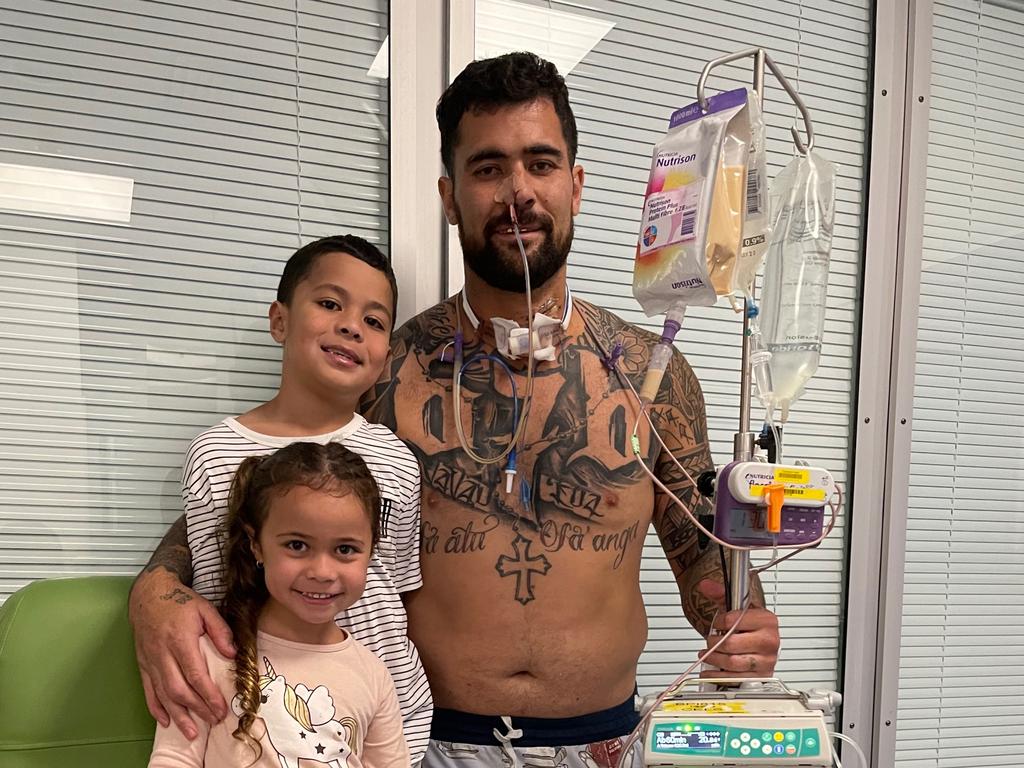 Andrew Fifita pictured with his children after coming out of intensive care.