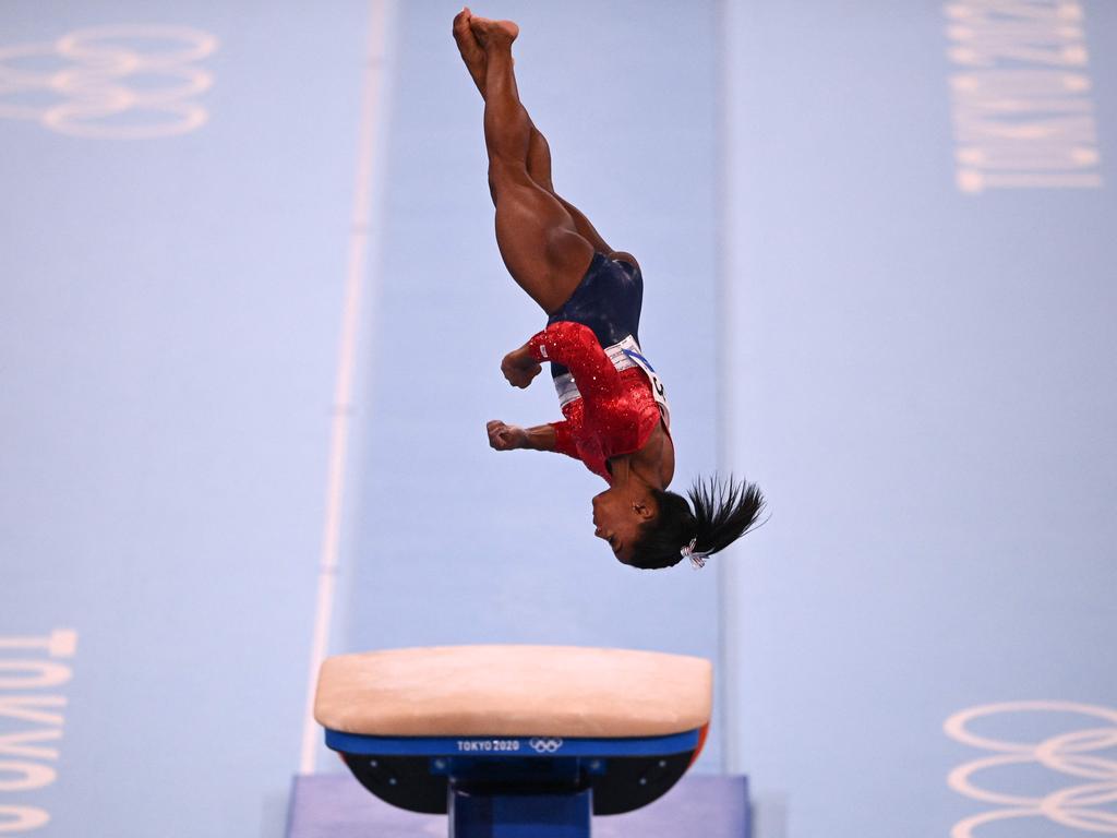 Biles competes in the vault before eventually pulling out. Picture: AFP