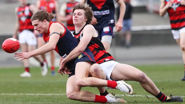 North Hobart’s Jye Menzie is tackled by Harry Richmond (Lauderdale) in round three. Picture: NIKKI DAVIS-JONES