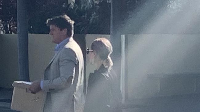 Michael and Nicole Saunders leaving Mackay courthouse after day one of a magistrates court hearing involving Whitsunday Anglican School