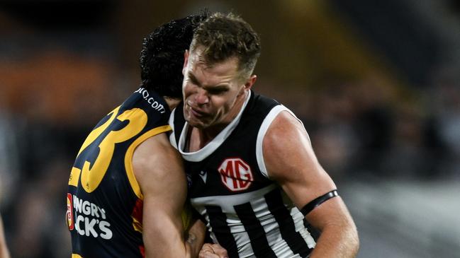 ADELAIDE, AUSTRALIA - AUGUST 17:   Izak Rankine of the Crows is knocked out by  a late hit from  Dan Houston of the Power during the round 23 AFL match between Port Adelaide Power and Adelaide Crows at Adelaide Oval, on August 17, 2024, in Adelaide, Australia. (Photo by Mark Brake/Getty Images)