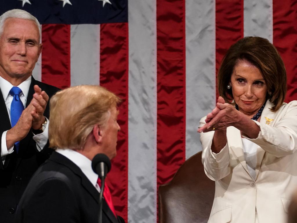 Donald Trump arrives to deliver the State of the Union address, alongside Speaker of the House Nancy Pelosi. Picture AFP