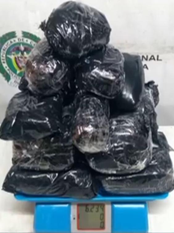 Colombian police weigh the cocaine Cassie Sainsbury allegedly tried to smuggle out of the country.