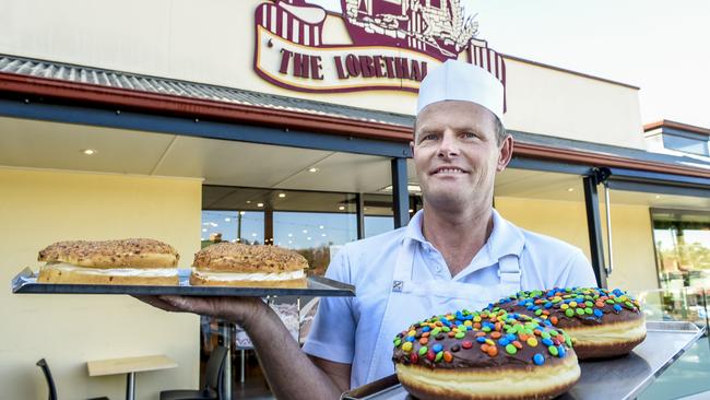 There’s doughtnuts and then there’s Lobethal Bakery’s famous giant doughnuts, seen here with owner Albert Trinkle. Picture: Roy Van Der Vegt