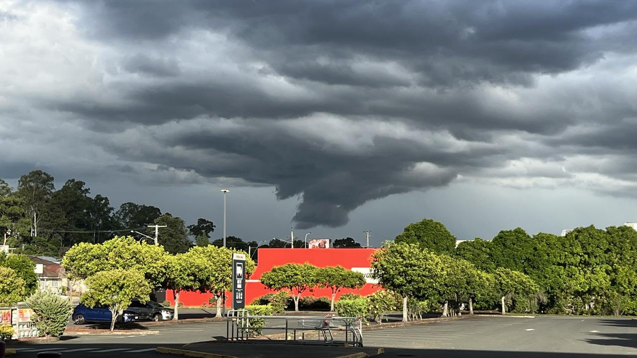 Dark clouds were formed above Brisbane Airport on Saturday. Picture: Anthony Reginato