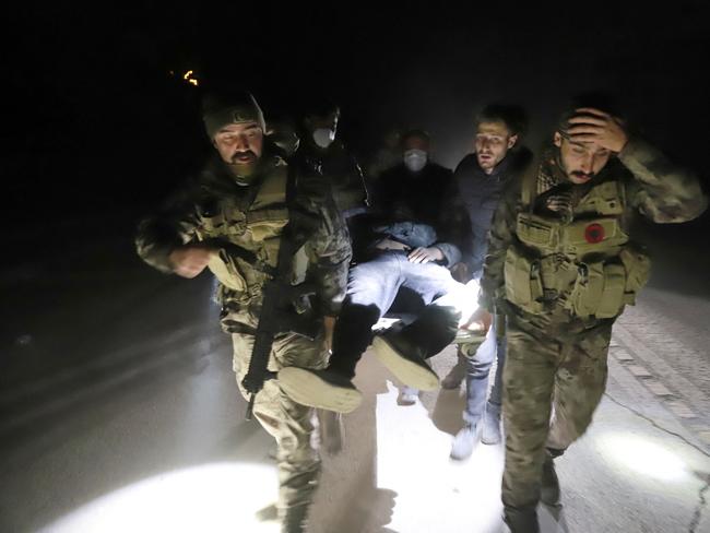 Members of Turkish police special forces carry a wounded man after a new earthquake in Antakya, Hatay province, Turkey. Picture: Reuters