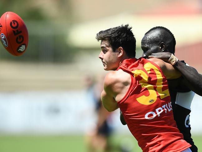 Fogarty competes with Aliir Aliir during a practice match against Port Adelaide.