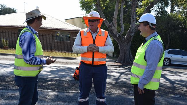 Infrastructure councillor Tony Williams, Boral Asphalt Dave Daniel and Councillor for Waste Shane Latcham inspect the road.