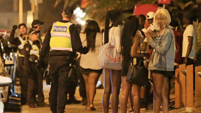 Youths in St Kilda on Saturday night. Picture: Mark Stewart