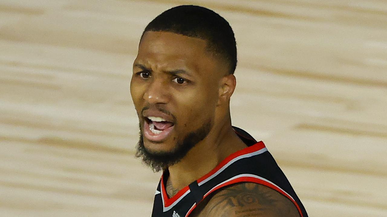 LAKE BUENA VISTA, FLORIDA - AUGUST 15: Damian Lillard #0 of the Portland Trail Blazers reacts against the Memphis Grizzlies during the second quarter in the Western Conference play-in game one at The Field House at ESPN Wide World Of Sports Complex on August 15, 2020 in Lake Buena Vista, Florida. (Photo by Kevin C. Cox/Getty Images)