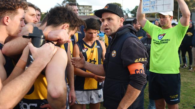 Hurstbridge coach Jarrod Tilley speaks to his players. Picture: Josie Hayden