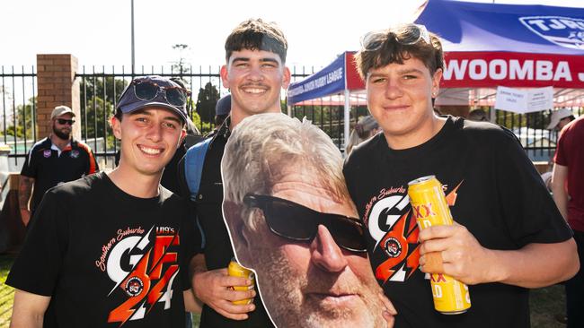 Southern Suburbs supporters and players (from left) George Jerrard, Declan Pearson and Kobi Carr with a portrait of the U19 coach Darren Wilson on TRL grand final day at Toowoomba Sports Ground, Saturday, September 14, 2024. Picture: Kevin Farmer