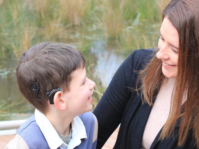 Henry Selby, 9, with mother Lisa. Henry’s cochlear implant was notprogrammed correctly. Picture: supplied by Lisa Selby