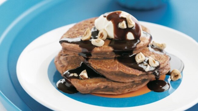 Chocolate ricotta pancakes with hazelnut sauce. Picture: taste.com.au.