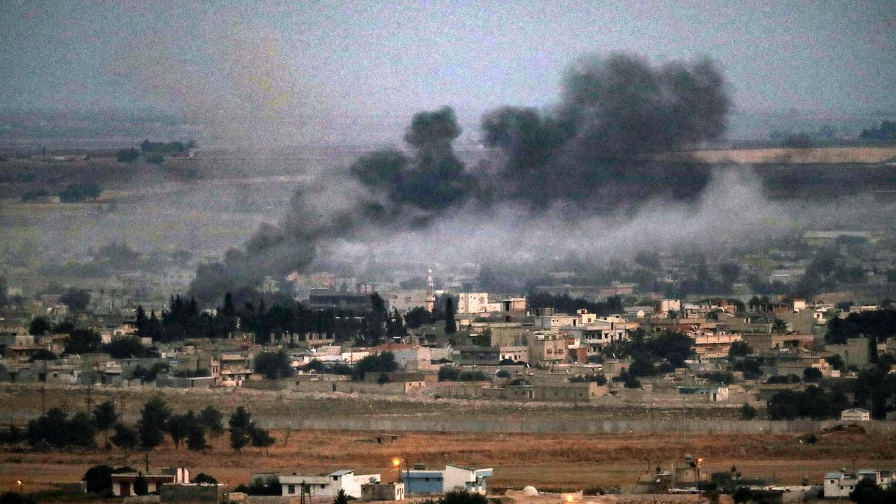 Smoke rising from the destruction left in the Syrian town of Ras al-Ain. Picture: Burak Kara/Getty Images.