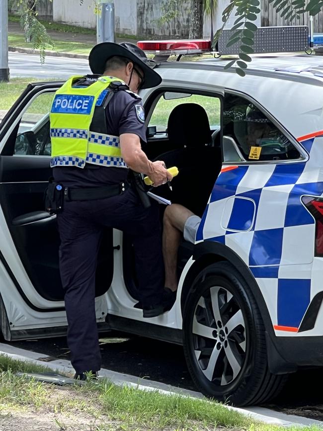 Police conducting roadside breath test in Southport speak to a man who allegedly blew over the limit. Picture: Keith Woods.