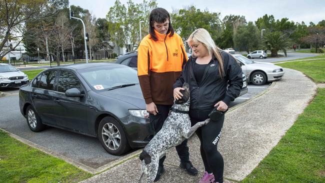 Cooper and Carly McIntyre with dog Mitchy. Picture: Mark Brake