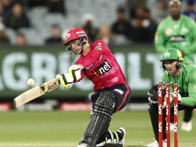 MELBOURNE, AUSTRALIA - DECEMBER 15:  Josh Philippe of the Sydney Sixers hits a six and the winning runs to finish on 99 not out during the Men's Big Bash League match between the Melbourne Stars and the Sydney Sixers at Melbourne Cricket Ground, on December 15, 2021, in Melbourne, Australia. (Photo by Darrian Traynor/Getty Images) *** BESTPIX ***