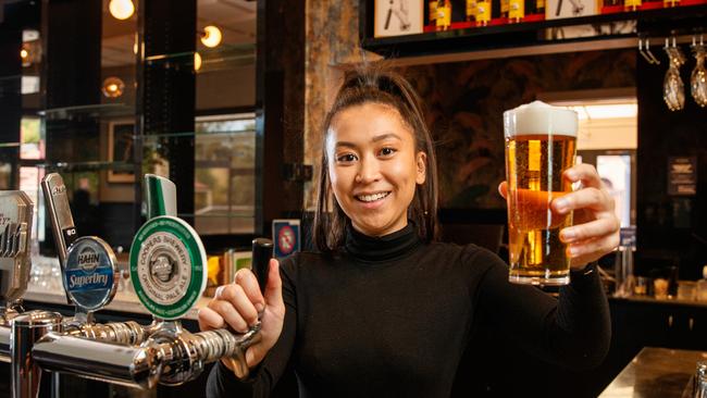 Julienne Vargas getting ready to pour beers at the Sussex Hotel, Walkerville. Picture: Matt Turner