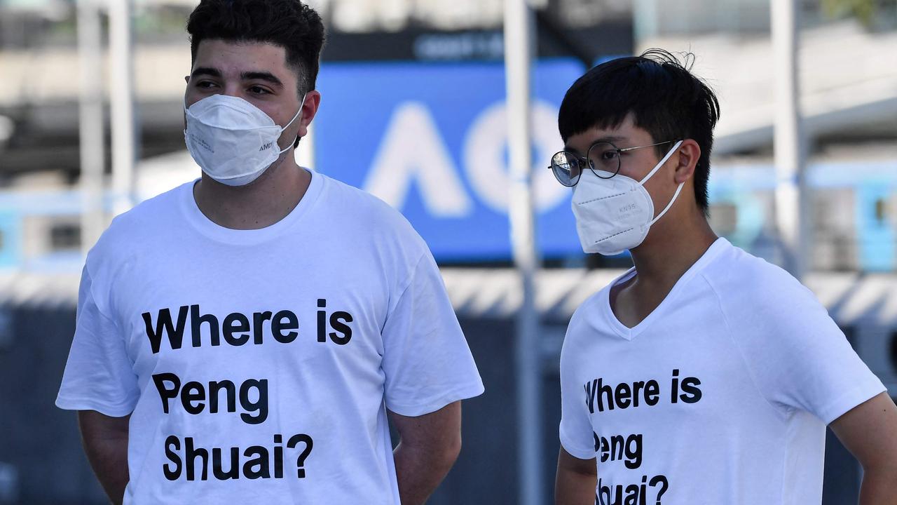 Australian human rights campaigner Drew Pavlou (L) is pictured wearing a "Where is Peng Shuai?"