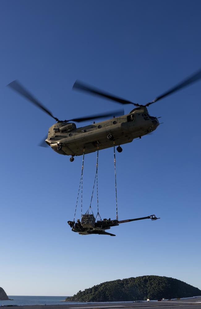 A CH-47 Chinook lifts an M777 howitzer from the Australian Amphibious Force during Wet and Dry Environmental Rehearsals off the coast of North Queensland. Picture: Corporal Michael Rogers