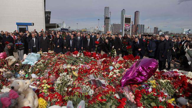 Ambassadors and representatives of diplomatic missions accredited in Russia stand at attention as they attend a flower laying ceremony at the memorial in memory of the victims of the terrorist attack at the Crocus City Hall. Picture: AFP