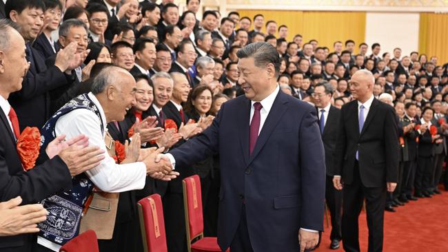 Xi Jinping, Cai Qi and Ding Xuexiang meet with representatives of retired officials at the Great Hall of the People in Beijing. Picture; Zuma Press