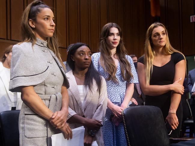 (L-R)US Olympic gymnasts Aly Raisman, Simone Biles, McKayla Maroney and gymnast Maggie Nichols leave after testifying during a Senate Judiciary hearing about the Inspector General's report on the FBI handling of the Larry Nassar investigation of sexual abuse of Olympic gymnasts, on Capitol Hill, September 15, 2021, in Washington, DC. (Photo by SAUL LOEB / POOL / AFP)