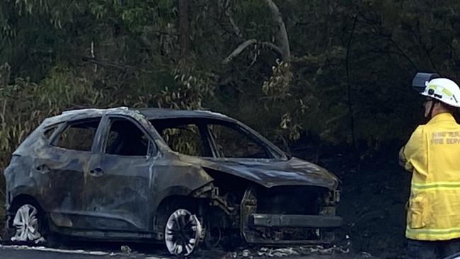 A car caught alight on Heathcote Rd at Lucas Heights. Picture: Ashleigh Tullis