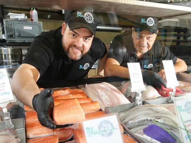 Blu by Australian Seafood brings in fresh seafood every morning. Owner Theodore Patsiotis and his father Con with salmon. Picture Norm Oorloff