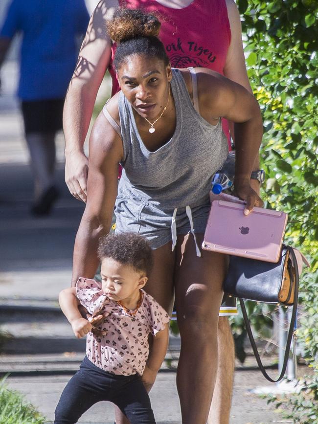 Serena Williams and her husband Alexis Ohanian enjoy an afternoon walk with their 1-year-old daughter Alexia Olympia. Serena's daughter looked seriously cute, toddling her way down the footpath, wearing Nike sneakers like her Mummy. Picture: MediaMode