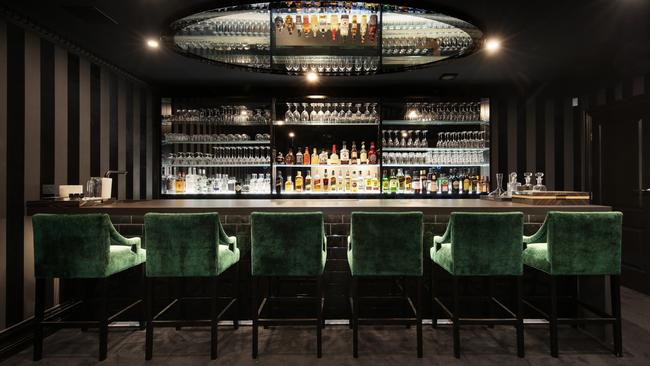 Warne’s basement features a nightclub-quality bar.