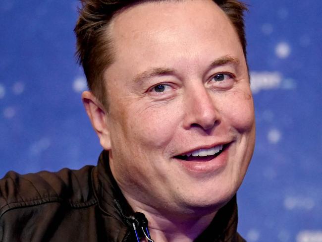 (FILES) In this file photo taken on December 01, 2020, SpaceX owner and Tesla CEO Elon Musk poses as he arrives on the red carpet for the Axel Springer Awards ceremony, in Berlin. - Tesla reported another round of record quarterly profits on January 25, 2023, while confirming its long-term production outlook in spite of concerns about rising competition and macroeconomic headwinds. (Photo by Britta Pedersen / POOL / AFP)