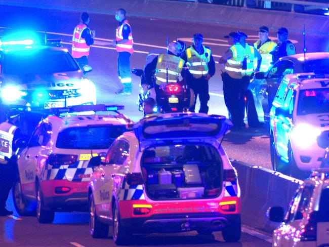 FEES APPLY, ONE TIME USE ONLY. MUST CREDIT.  Two dead after four vehicle crash on Anzac Bridge in Pyrmont, NSW ., The incident began with a minor crash shortly before 11.50pm (Friday 2 December 2022), in the citybound lanes of the Bridge, near the Pyrmont exit, involving a Toyota Camry sedan and a Holden Captiva station wagon., , Police believe the drivers of those vehicles were standing on the roadway when they have been allegedly struck by a Holden Commodore sedan., , A Toyota Camry taxi also became involved. Both the woman driving the Camry and the man driving the Captiva died at the scene. They are yet to be formally identified., , A man driving the taxi has been taken to Sydney Eye Hospital for mandatory testing, while a man driving the Commodore has been taken to Royal Prince Alfred Hospital to be treated for injuries sustained in the crash, and mandatory testing., , Officers from Sydney City Police Area Command have established a crime scene with specialist investigations being conducted by the Crash Investigation Unit., , Investigators are keen to hear from anyone with dashcam vision of the incident, or the circumstances leading up to the crash, especially those drivers travelling westbound between 11.45pm and 11.55pm., , It’s expected the bridge could remain closed for up to eight hours, and motorists are advised to check www.livetraffic.com for updates and diversions., , Anyone with information about this incident is urged to contact Crime Stoppers: 1800 333 000 MUST CREDIT OnScene Bondi