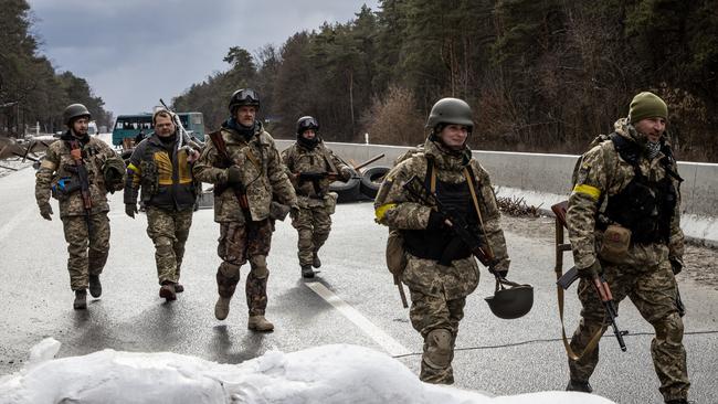 Members of the Ukrainian military arrive to reinforce a forward position on the eastern frontline near Kalynivka village on March 8 in Kyiv, Ukraine. Picture: Chris McGrath/Getty Images