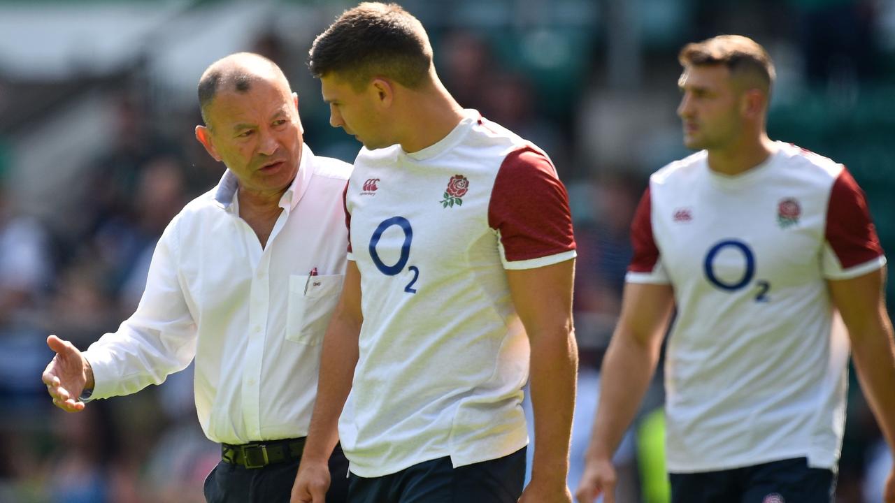 England coach Eddie Jones talks with scrumhalf Ben Youngs at Twickenham.