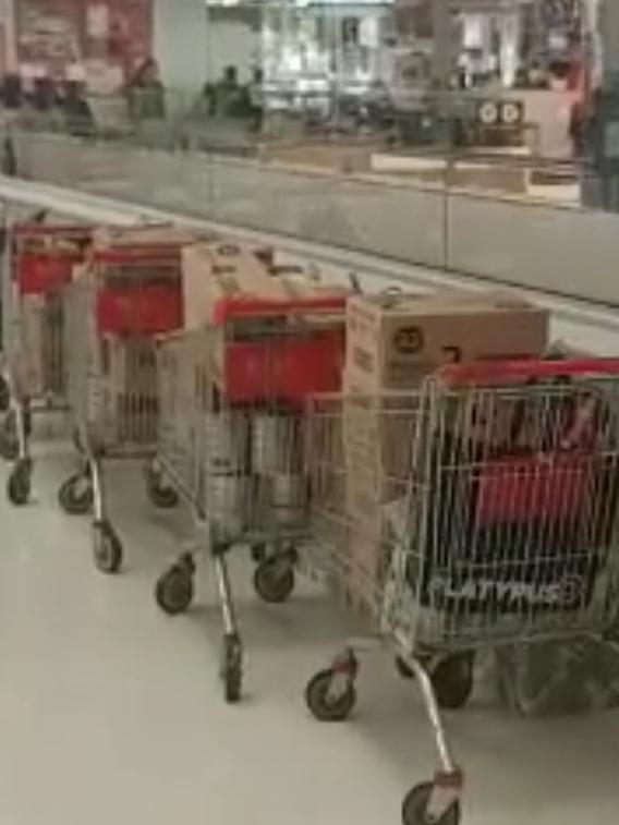 At least five trolleys full of boxes of baby formula were lined up.