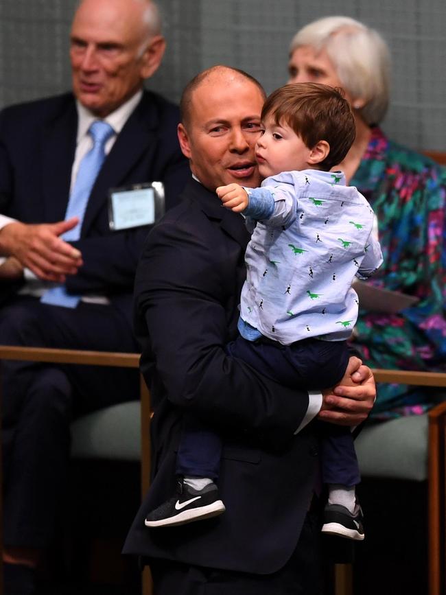 Treasurer Josh Frydenberg holds son Blake. Picture: AAP Image/Lukas Coch