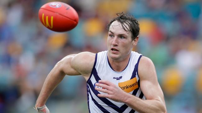 Brennan Cox hunts the footy. Picture: Russell Freeman/AFL Photos