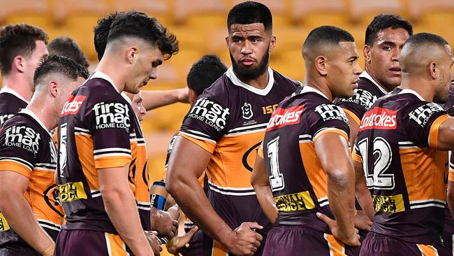 Broncos players look dejected during their record loss to the Roosters on Thursday night Picture: AAP