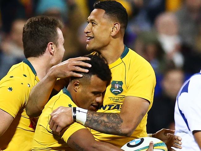 CANBERRA, AUSTRALIA - SEPTEMBER 16: Will Genia and Israel Folau of the Wallabies embrace after a try by Genia during The Rugby Championship match between the Australian Wallabies and the Argentina Pumas at Canberra Stadium on September 16, 2017 in Canberra, Australia.  (Photo by Mark Nolan/Getty Images)