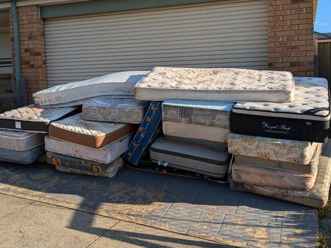 An invoice dispute has ended in legal action after a customer decided the fee was too high and the business dumped 26 old mattresses on the customer's driveway for an unpaid bill. Picture: Reddit