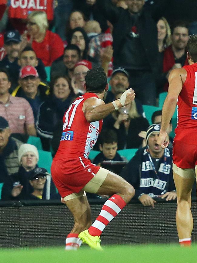 Sydney Swans' Adam Goodes celebrates a goal with an Indigenous dance directed at the crowd during AFL match Sydney Swans v Carlton at the SCG. pic. Phil Hillyard