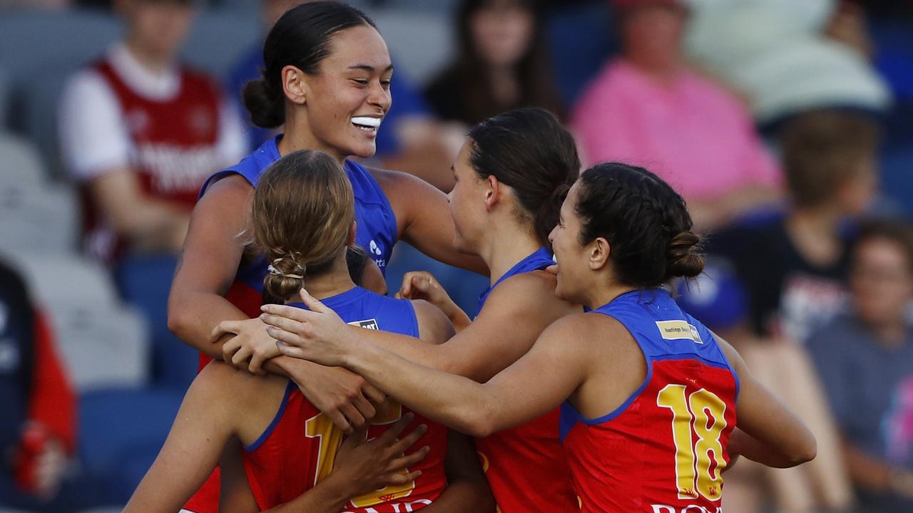 BALLARAT, AUSTRALIA - MARCH 13: Courtney Hodder of the Lions celebrates a goal with teammates during the 2022 AFLW Round 02 match between the Western Bulldogs and the Brisbane Lions at Mars Stadium on March 13, 2022 in Ballarat, Australia. (Photo by Dylan Burns/AFL Photos via Getty Images)