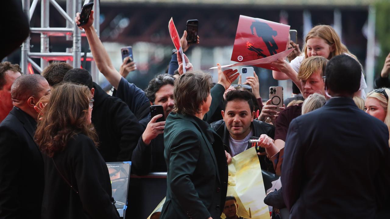 Dozens of people clamoured to get his attention for photos and autographs. Picture : NCA Newswire / Gaye Gerard