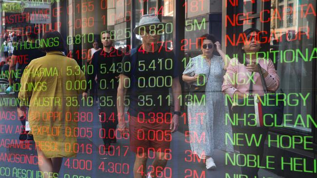 ????SYDNEY, AUSTRALIA : NewsWire Photos - FEBRUARY 24 2025; A general view of people walking past the digital boards of the ASX in the Sydney CBD. Picture: NewsWire/ Gaye Gerard