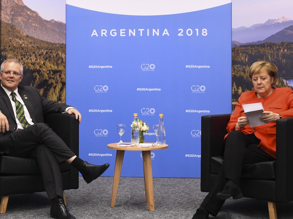 German Chancellor Angela Merkel checks her notes as she sits down for a bilateral meeting with Australian PM Scott Morrison at the G20 summit in Buenos Aires. Picture: AAP