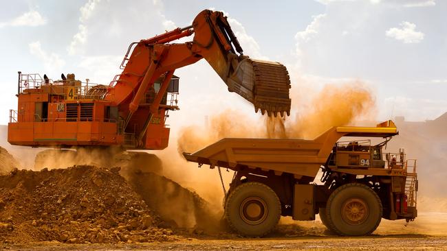 A haul truck is loaded by a digger with material from the pit at Rio Tinto Group's West Angelas iron ore mine in Pilbara, Australia. Picture: Ian Waldie/Bloomberg via Getty Images