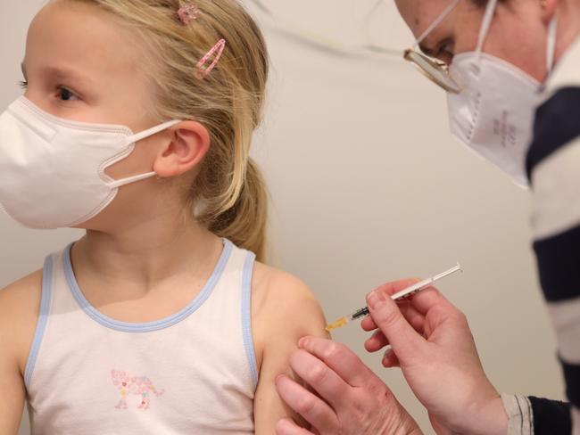 COLOGNE, GERMANY - DECEMBER 18: Elisabeth receives a dose of COVID-19 Pfizer-BioNTech Comirnaty vaccine for children at the children's section of the Lanxess Arena vaccination center during the fourth wave of the novel coronavirus pandemic on December 18, 2021 in Cologne, Germany. Germany has launched Covid vaccinations for children in the 5-11 age group this week as infection rates, which had skyrocketed in recent weeks, show signs of coming down, though experts are warning that the spread of the Omicron variant could soon cause infections to rise anew.  (Photo by Andreas Rentz/Getty Images)