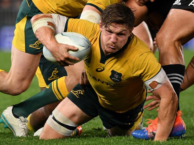 Michael Hooper works hard while in possession during the Bledisloe Cup contest.